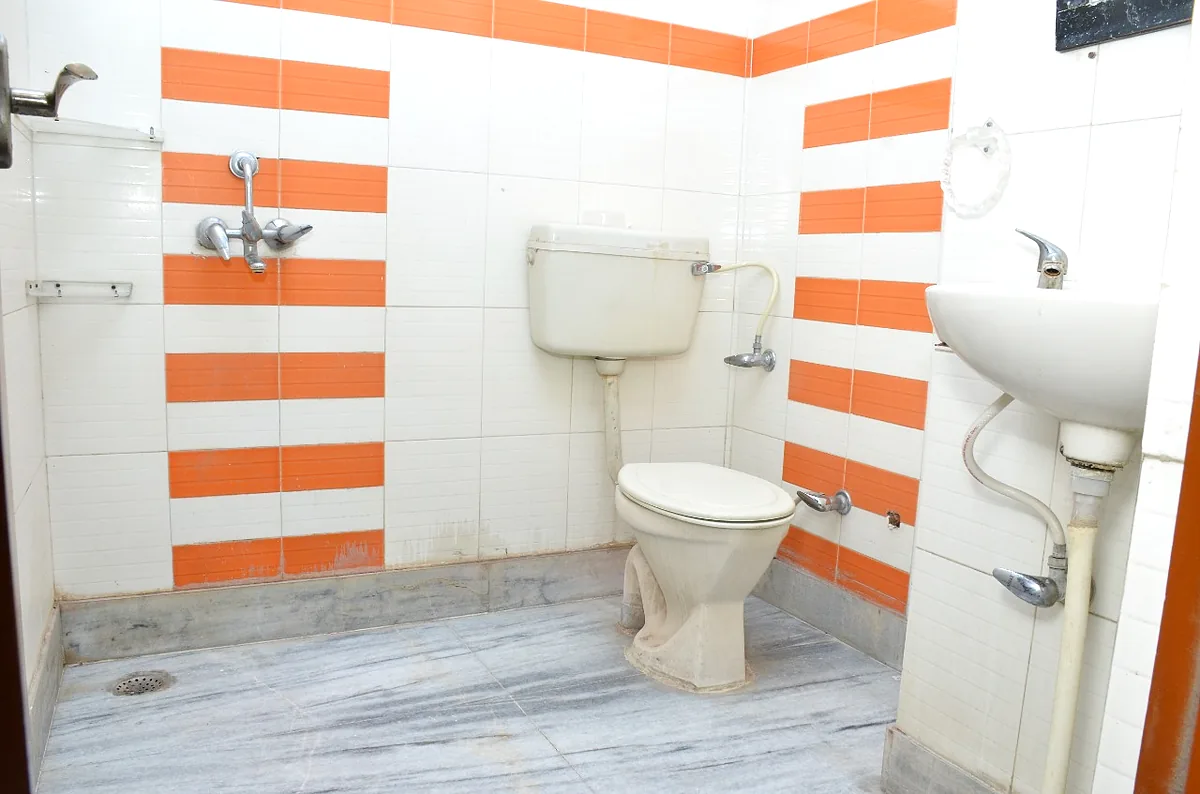 Well-maintained attached washroom with modern fittings
